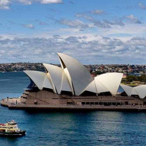 Sydney Opera House and Harbour Bridge seen across the water at dusk Sydney Opera House and Harbour Bridge seen across the water at dusk