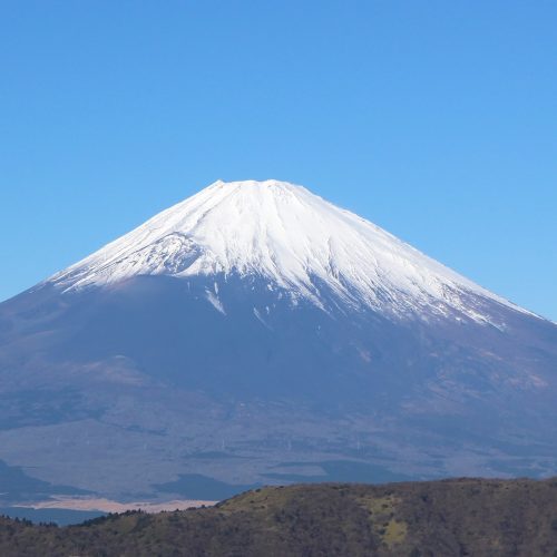 Mount Fuji rising behind Chureito Pagoda and cherry blossoms Mount Fuji rising behind Chureito Pagoda and cherry blossoms