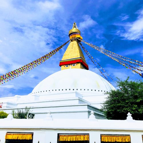 The white dome and golden spire of Boudhanath stupa in Kathmandu The white dome and golden spire of Boudhanath stupa in Kathmandu