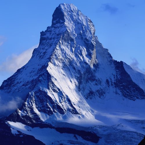 The Matterhorn peak reflected in an alpine lake near Zermatt