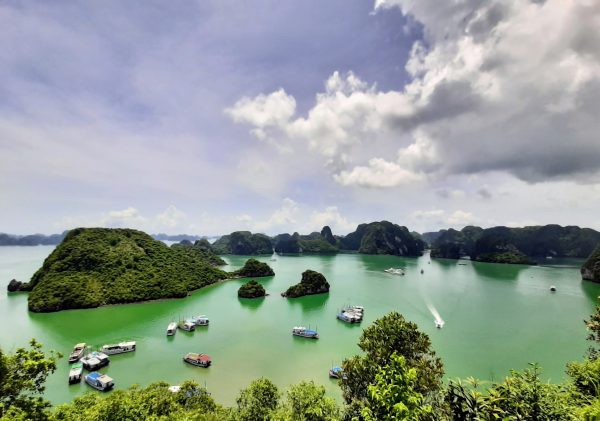 Limestone karsts and junk boats in Ha Long Bay, Vietnam Limestone karsts and junk boats in Ha Long Bay, Vietnam